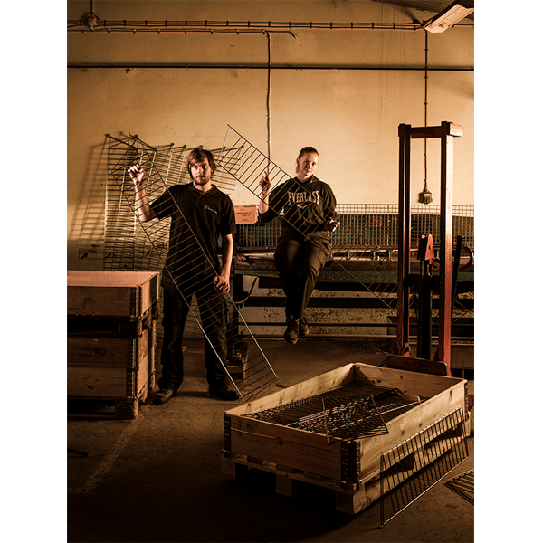 Swedish factory workers holding components of the String system. (photo: Bruno Ehrs)