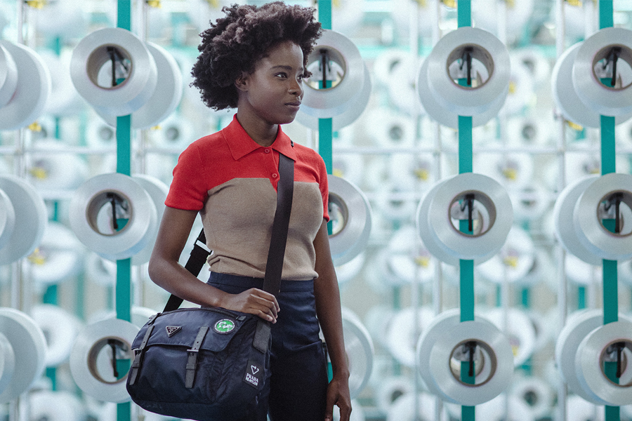 Prada reporter Amanda Gorman, the inaugural US Youth Poet Laureate whose work celebrates community and social change, with the new Prada ReNylon shoulder bag. (photo: Prada)