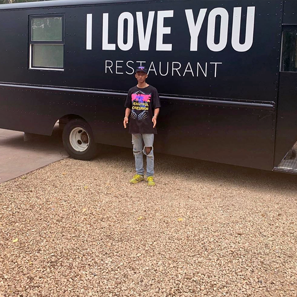 Jaden Smith standing in front of the "I Love You Restaurant" food truck in downtown Los Angeles, July 2019. (photo: courtesy)